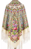 Colorful floral patterned oversized ivory  shawl with tassels on a white background