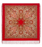 Red woolen scarf with intricate gold and beige paisley pattern on a white background