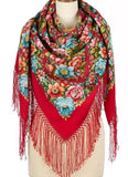 Colorful floral patterned pashmina red scarf with large flowers fringes on a mannequin