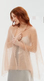 Delicate beige openwork beige stole hand-knitted from hypoallergenic goat down wool, offering a lightweight, cloud-soft accessory for women.