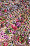 Close-up of a colorful floral and paisley patterned fabric.