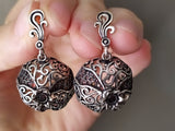 A pair of sterling silver 925 earrings with pomegranate-shaped dangle and natural faceted garnet stones.