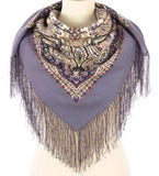 Scarf with purple lavender pattern and fringes on a mannequin against a white background