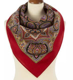 Red Slavic scarf without a fringe with  a patterned design draped over a mannequin on a white background