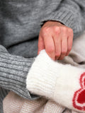 Soft knit mittens in sizes XS to M showcasing a flexible stretch fit that accommodates hand circumferences from 6 to 8 inches.