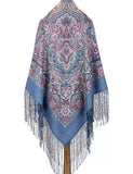 Decorative shawl with paisley pattern and fringes on a white background