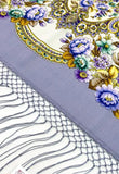 Decorative fabric with floral patterns and intricate designs on a textured background