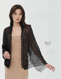 A person wearing a narrow, rectangle black pashmina shawl draped elegantly over the shoulders, displaying its ultra-thin and lightweight sheer drape. Detailed texture shot of an organic woolen pashmina black shawl, showcasing the fine, gossamer-thin weave resembling delicate lace.
