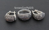 A set of sterling silver jewelry, including a ring and earrings, with marcasites and orange zircon stones, displayed against a dark background with the watermark 'ArmenianSpirit'.