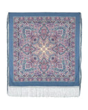 Decorative blue blanket shawl with pink pattern and fringes on a white background