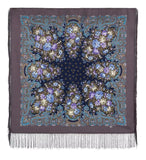 Decorative scarf with floral patterns and fringes on a plain background