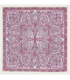 Pink and purple paisley patterned square merino wool shawl on a white background