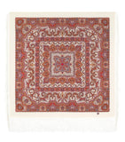 Decorative large winter shawl with brick colored patterns on a white background
