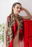 Woman wearing a colorful red oversized woolen scarf with fringe  against a white background