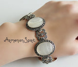 Vintage inspired old style bracelet with marcasite and oval beige pearly stones in a flat design and made from sterling silver by Armenian silversmith.