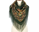 Green floral paisley scarf premium quality merino woolen with fringe on a mannequin against a white background