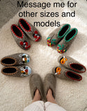 Pair of gray merino wool slippers with colorful designs on a textured surface, with text prompting to message for other sizes and models.