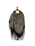 Paisley patterned scarf with fringes on a mannequin against a white background