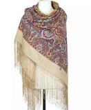 Indian mandala and paisley patterned merino wool shawl with fringes on a mannequin against a white background