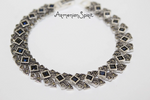 This silver 925 bracelet features vibrant navy topaz stones that exude the beauty and spirit of Armenian culture. Made with high-quality materials, this elegant piece can be customized to any desired length for a perfect fit. Elevate any outfit with this timeless and meaningful accessory.