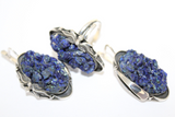 Handmade jewelry silver earrings and ring with bright azzurite gemstone and flowers arround earrings and ring.