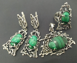 large handmade malachite jewelry set with herbal and branches details. The green stone is oval and stripped. The set insludes long earrings, very large pendant and eye catching ring.