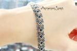 This luxurious bracelet features a timeless design with blue topaz stones set in elegant silver 925. Elevate any outfit with this modern piece of jewelry, adorned with marcasite for added sparkle. Perfect for any occasion, this Armenian Spirit bracelet exudes sophistication and style.