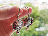 Armenian earrings in a shape of pomegranates flat with red garnet gemstone, preferebly garnet.The earrings has beautiful Armenian ornament on them, which resembels Armenian taraz patterns.