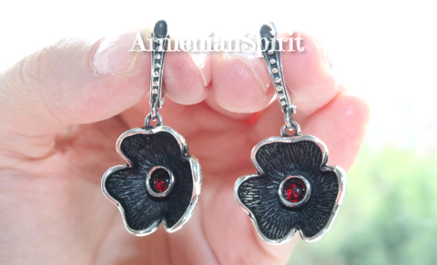 For lovers of classy small dangling earrings ina shape of black flower with red small  garnet stone. The earrings are very comfortable for women who has small earlobe and ears.