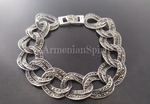 This Sterling Silver 925 bracelet with marcasite detailing boasts large links that make a bold statement for any lover of gothic style. It's a perfect gift for women who appreciate unique and intricate jewelry designs inspired by Armenian spirit. Elevate your accessory game with this one-of-a-kind piece.