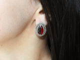 Indulge in the luxurious beauty of Armenian Spirit's small earrings. Made from sterling silver 925 and adorned with a striking red stone, these earrings are guaranteed to make a statement. Each piece is carefully crafted with marcasite, adding a touch of sparkle to your look. With free shipping available worldwide, treat yourself to this exquisite jewelry from Armenia.