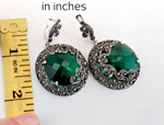 Buy massive earrings round with English lock and emerald green large gemstone.