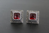 Where to buy burgundy red earrings for woman who loves vintage rare finds. The earring are made of silver with marcasites. The earrings are small and square.