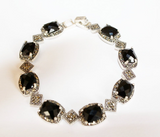 If you are a lover of the Renaissance, then you will love this chic bracelet made in vintage style. The bracelet is made of 925 sterling silver, shining marcasite and black faceted onyx.The stones are carved in the shape of rectangles. The bracelet is equally suitable for both adult women and young girls.