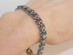 Add a touch of luxury and elegance to your outfit with this stunning Armenian Spirit bracelet. Made with high-quality sterling silver and adorned with marcasite stones, this bracelet is perfect for any cocktail party or special occasion. Elevate your style and make a statement with this unique piece. Perfect for the woman who wants to feel confident and rich.