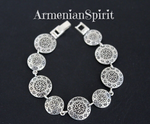What a beautiful and unique bracelet! This bracelet is made in ethnic traditional Armenian style with sterling silver coins . The coins are middle size and&nbsp; has ethnic Armenian ornament.