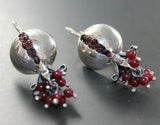 These beautiful earrings are made with 925 silver and feature a pomegranate design adorned with garnet stones. Handcrafted by a top-rated Armenian jewelry store on Etsy, they embody the rich cultural heritage and spirit of Armenia. Elevate your style with these unique and expertly crafted earrings.