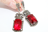 Step into timeless elegance with Armenian Spirit's sterling silver jewelry. Our Mid-century inspired pieces feature red topaz and marcasite, carefully designed to bring out your inner Victorian. Shop our etsy store for high quality, very large earrings that will make a statement in any era.