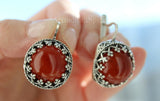 Do you like carnelian brown gemstone jewelry and do not know where to buy? These earrings in midevial style looks like vintage old fashioned jewellery, but it is new and never worn. The earrings has round shape with royal design around the cabochon gemstone which is round and brown.