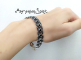 Add an Armenian touch of elegance to your outfit with our luxurious Silver 925 black onyx bracelet. The black square onyx stones add a sophisticated and timeless touch, while the marcasite silver adds a hint of sparkle. Perfect for any occasion, this bracelet is a great gift for the stylish and fashionable woman in your life. Made for the refined and chic Armenian woman.