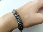 This luxurious silver bracelet is made with high-quality black square onyx stones and marcasite, perfect for a stylish and sophisticated look. A perfect gift for a woman who appreciates elegance and glamour. The rich, Armenian design adds a touch of culture to this already stunning piece.