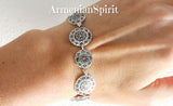 Indulge in the luxurious beauty of our Bracelet Coins Silver 925 for women. Handcrafted in the traditional Armenian style, this stunning bracelet showcases sterling silver coins adorned with ethnic Armenian ornaments. A true statement piece that adds an elegant and unique touch to any outfit.