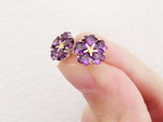 Discover unique and beautiful 925 silver jewelry from Armenia. These earrings feature purple "Forget-Me-Not" flowers, a symbol of remembrance for the Armenian genocide. The hypoallergenic small studs are perfect for everyday wear, adding a touch of elegance to any outfit.
