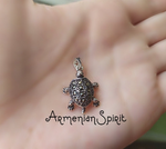 Bring a touch of luxury and charm to your style with our new Tortoise pendant. Made of genuine Silver 925, this tiny and delicate piece is perfect for any woman who loves turtles. Whether it's a work-related accessory or a thoughtful gift, this pendant is sure to make a statement.