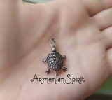 Bring a touch of luxury and charm to your style with our new Tortoise pendant. Made of genuine Silver 925, this tiny and delicate piece is perfect for any woman who loves turtles. Whether it's a work-related accessory or a thoughtful gift, this pendant is sure to make a statement.