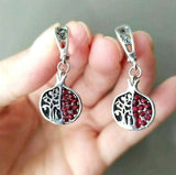 In the Armenian tradition and culture, the pomegranate tree acts as a symbol of life, prosperity , love and marriage, as well as prosperity and fertility, because pomegranate trees give their fruits all year round. These silver earrings in a shape of pomegranate has a tree on them. The stones are red zircons like pomegranate seeds.