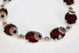Beautiful bracelet made by Armenian artisans. The bracelet`s material is sterling silver 925 with marcasites and&nbsp;oval burgundy stones. It is unique gift for your beloved woman. The bracelet looks very rich and precious. The stones color are wine red dark burgundy. We make all lengths of this bracelet.