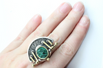 Armenian artisan jewelry Golden ring with silver 925 and malachite rough gemstone. The ring is made in midevial style and looks linke vintage old-fashioned jewelry.