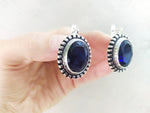 Buy silver earrings blue transparent stone looks like old fashinioned.