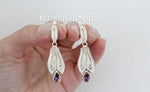 Upgrade your style with our high-quality Armenian Spirit earrings. Made with sterling silver 925 and adorned with vibrant purple zircons, these modern, long earrings feature a unique herbal ornament design. Elevate any outfit with this stunning piece of Armenian jewelry.  With free shipping and tracking, purchasing the best on Etsy and eBay has never been easier.  